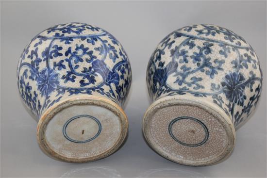 A pair of Chinese blue and white crackle glaze baluster vases, late 19th / early 20th century, 22cm